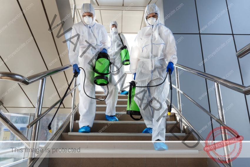 people wearing protective suits disinfecting stair 9YUZJS5 e1590675126802